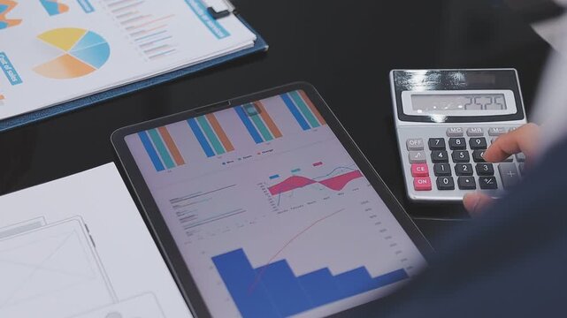 Financial Businesswomen analyze the graph of the company's performance to create profits and growth, Market research reports and income statistics, Financial and Accounting concept.