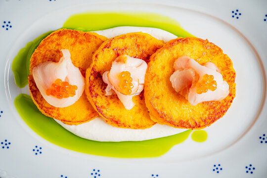 Delicious fusion of flavors with savory pancakes and fresh seafood delight