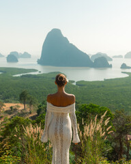 Woman in White Lace Dress at Samet Nangshe Viewpoint in Thailand