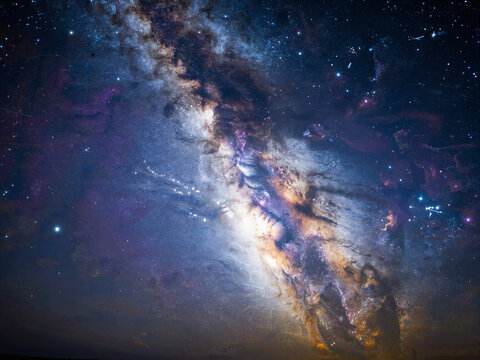 Milky Way galaxy and nebulae interwoven in the night sky