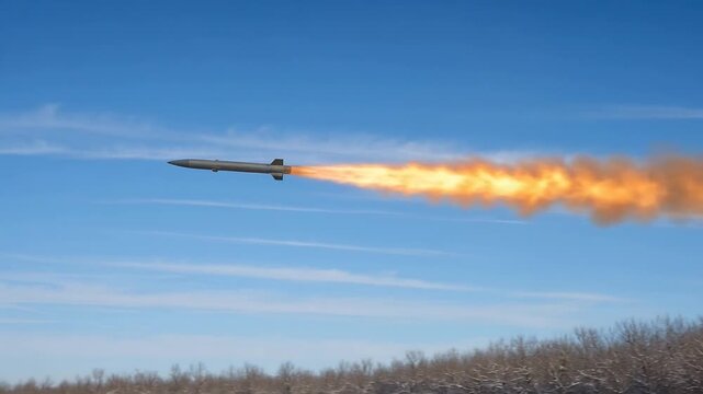 Rocket Propulsion Testing with Vibrant Flames Against a Clear Blue Sky and Smoke Trails