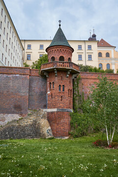 Red brick staircase tower integrated into the historic city walls at Bezrucovy Sady park in Olomouc, Czech Republic.