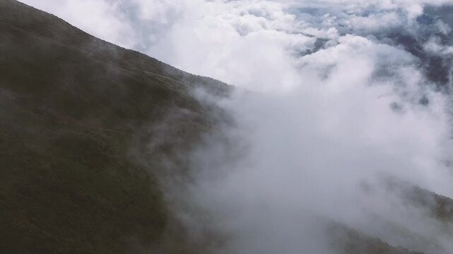 Fog Covered Mountain Ridge in Ecuador with Dense Green Forest, Low Clouds and Remote Andean Cloud Forest Wilderness Landscape