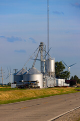 Grain silos and wind turbines illustrating modern agriculture © SNEHIT PHOTO