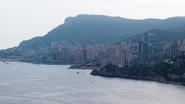 Wide aerial shot of Montecarlo skyline with modern buildings along the coastline