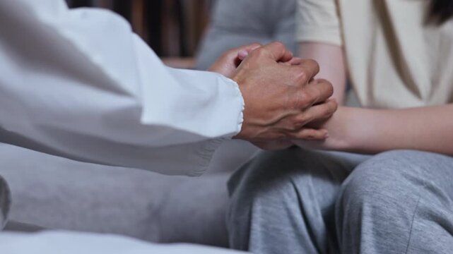 Psychologist comforting a teenager with depression during a mental health counseling session.