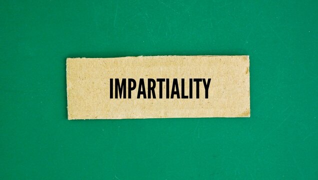 Paper boxes with the word Impartiality. the quality of treating everyone equally and making decisions without bias, prejudice, or favoritism