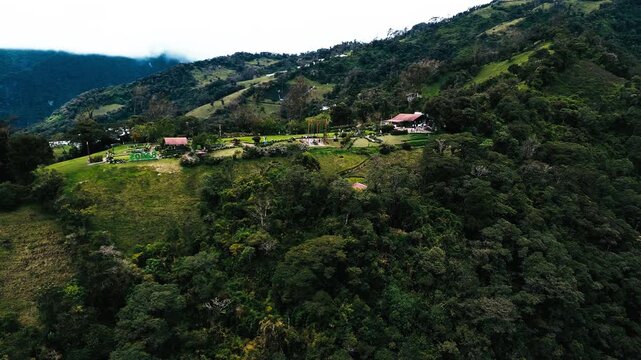 Aerial View of Mountain Lodge and Green Hills in Ecuador Cloud Forest, Rural Houses, Forested Slopes and Scenic Andean Travel Landscape