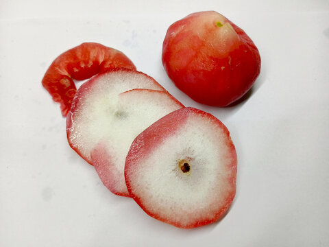 High Angle View of Fresh Sliced and Whole Water Apple Fruit on White Background