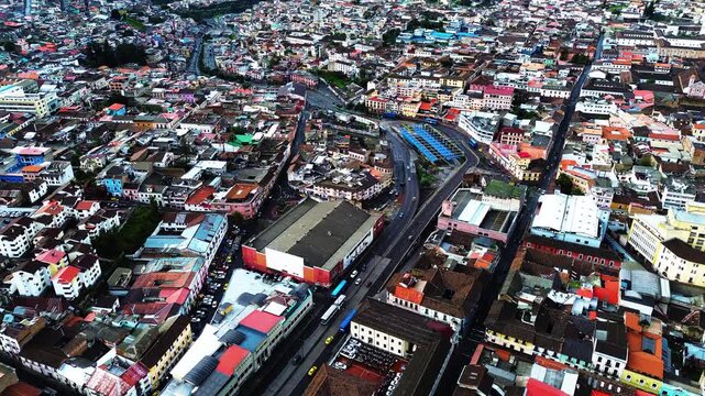 Aerial View of Quito Ecuador Urban District with Dense Rooftops, Highways, Modern Buildings and Mountain Basin, South American Capital Cityscape and Drone Travel Background