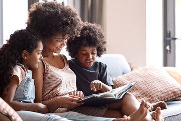 Mom, talk and reading book in house with children, ask questions and learn knowledge from...