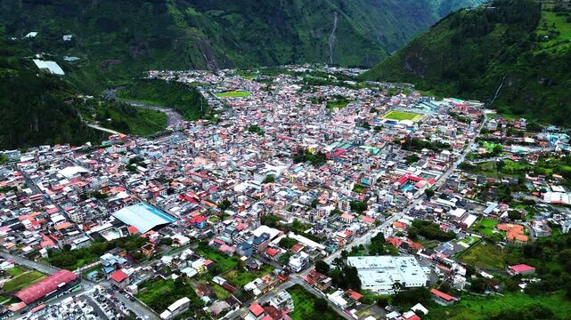 Aerial View of Quito Ecuador City Valley from El Panecillo with Dense Buildings, Green Hills, Roads and Mountain Urban Landscape Background