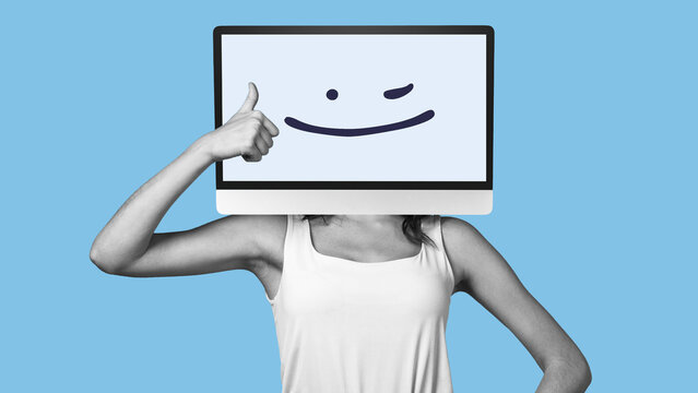 Person with a computer screen for a head giving a thumbs up to represent fake news