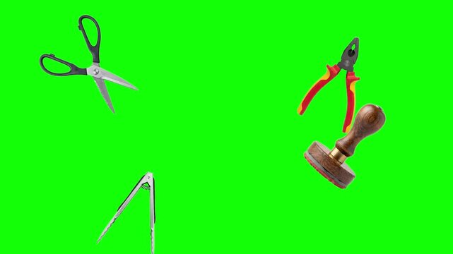 Collage of work tools scissors pliers and wooden stamps isolated on green screen background