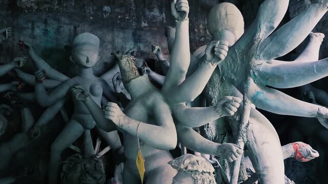The video shows the traditional process of making clay idols for festivals in West Bengal.