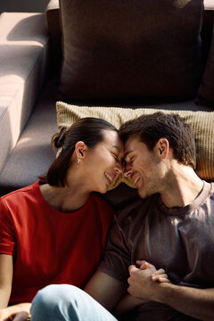 Affectionate couple in love enjoying in their new apartment.