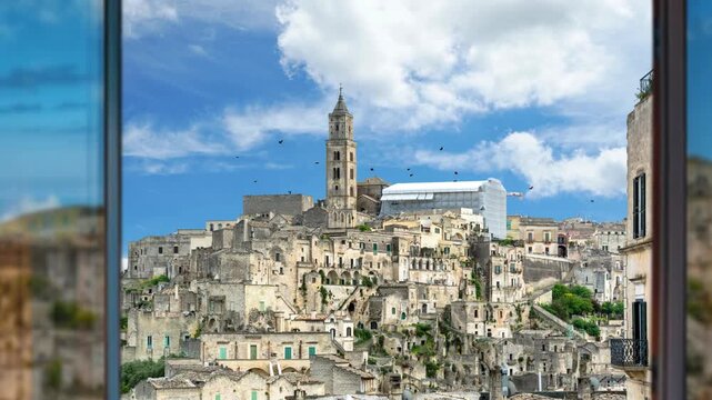 Medieval Town Of Matera Atop Rocky Outcrop In The Region of Basilicata, Southern Italy. Sassi di matera old town, panoramic view of typical stones and church of Matera. Aerial view from the old town