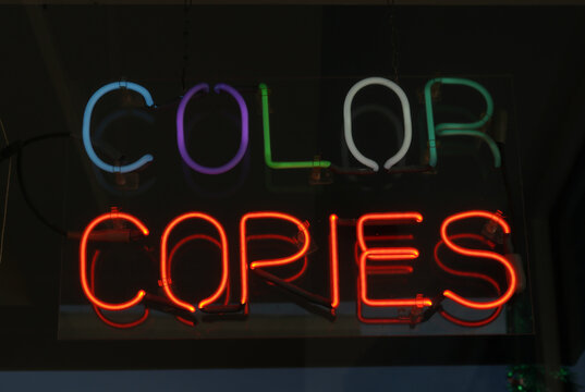 Color Copies Neon Sign in Window of Small Print Shop