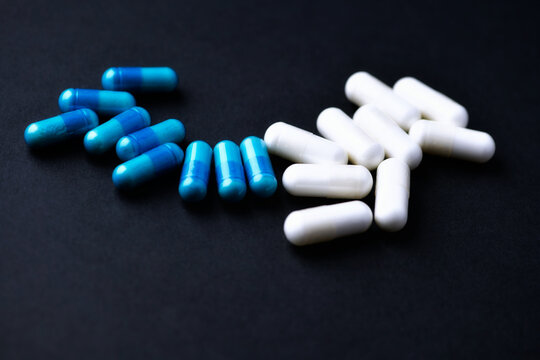 Amino acids and creatine capsules.Nutrition for bodybuilding. Fitness supplements on paper background. Soft focus. Close up