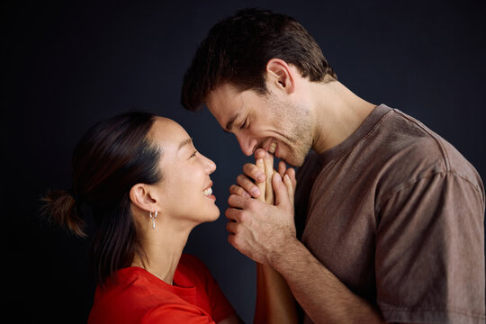 Happy couple in love enjoying in affectionate moments at home.