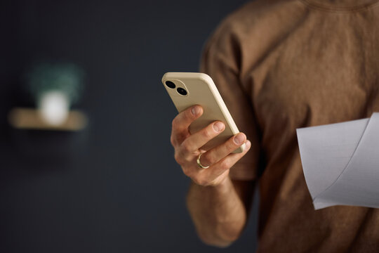 Close up of man using smart phone app.