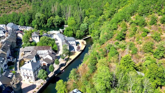September 10, 2026 - Aerial descending shot of the picturesque village of Esch-sur-S&ucirc;re in Luxembourg, nestled in a lush river valley.