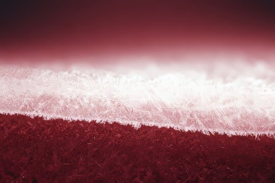 Colors blend in a landscape with red and white hues at a horizon in soft focus