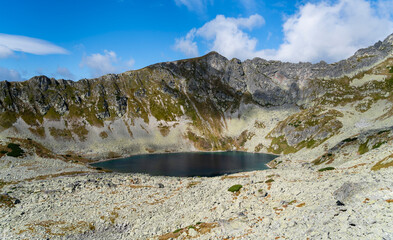 A lake in the valley below the ridge on a beautiful autumn day. © gubernat