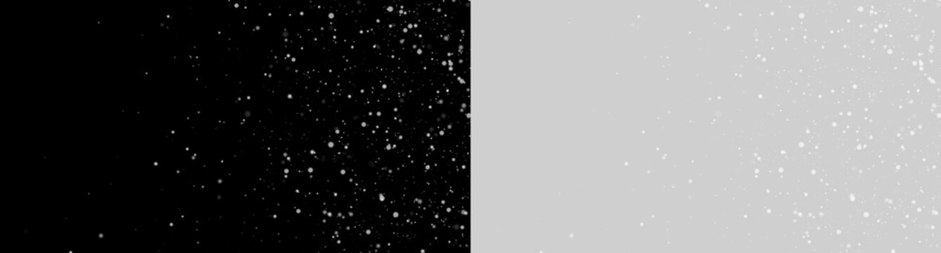 Scattered white particles are suspended against a black background. The dots vary in size and density across the frame. This image is ideal for representing dust, snow, or abstract space.
