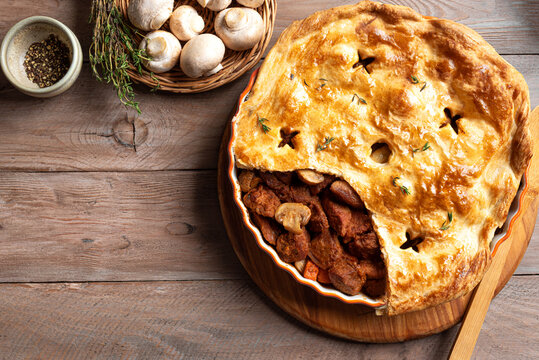Beef steak and mushroom pie, family meat pie