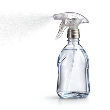 Clear plastic spray bottle filled with liquid misting water on a white background   