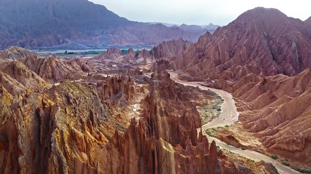 Aerial view of sharp sandstone ridges and deep canyons in the Red Mountain Stone Forest, Kuqa, Xinjiang, China