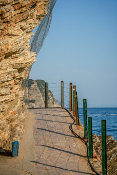 Scenic coastal path leading to Mogren Beach in Budva, Montenegro