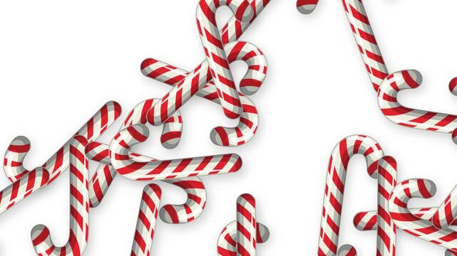 Red and White Striped Candy Canes Falling Against White Background