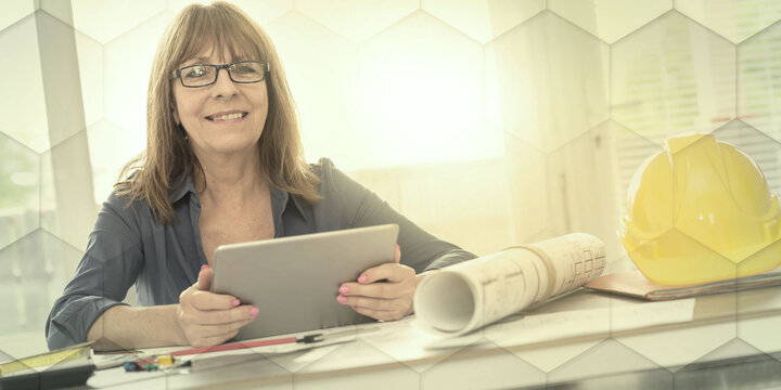 Portrait of female architect working on plans, light effet, geometric pattern