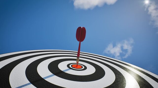 Low angle perspective of Red dart arrow hit bullseye target center with bright sunlight and blue sky. Performance and accuracy concept, 3D animation.