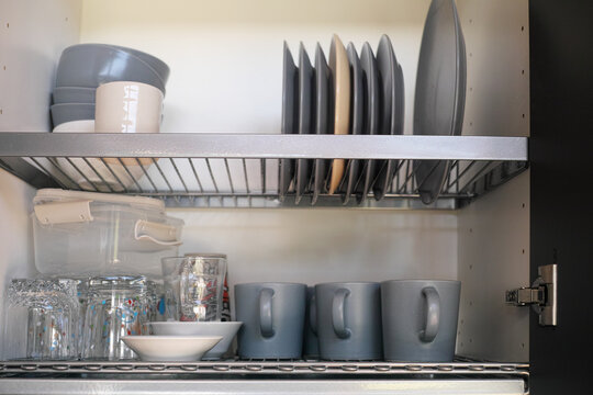 cupboard with clean kitchenware