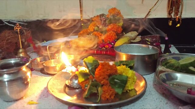 Hindu Puja Altar with Marigold Flowers, Diya Lamp and Traditional Offerings