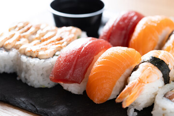 Assorted sushi platter with salmon, tuna, shrimp and rolls. Close up © chandlervid85