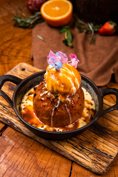 baked apple with ice cream on a plate