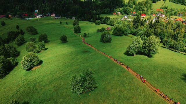 Aerial Footage of Athletes Competiting on Outdoor Running in Fields