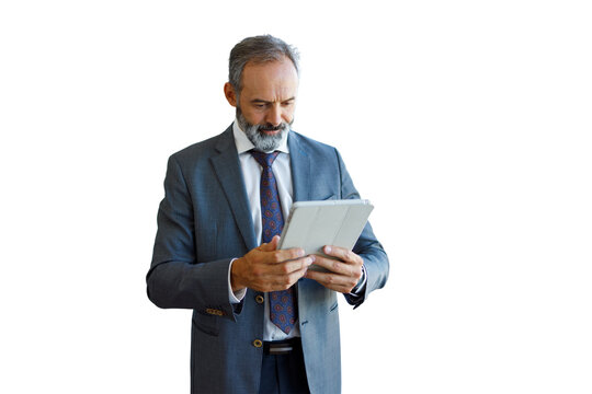 Mature businessman working with tablet representing technology leadership