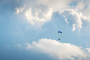 Sportsman flying with motorglider through dark clouds enjoying adrenaline © Ewald Fröch