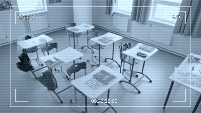 Security camera recording empty classroom with school supplies and backpacks from high angle. Clip suitable for educational safety campaigns, surveillance system ads, and security projects