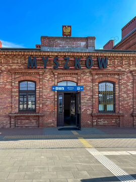 Myszkow, Poland, July 26, 2025: The railway station building in Myszkow. The red brick building is unplastered