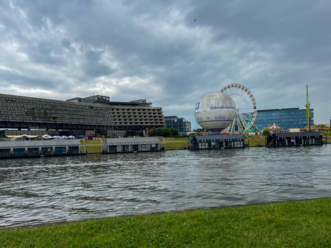 Krakow, Poland, July 26, 2025: The former Forum Hotel building in Krakow, Poland, on the Vistula River. A balloon with the words "Good Atmosphere" is next to it