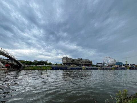 Krakow, Poland, July 26, 2025: The former Forum Hotel building in Krakow, Poland, on the Vistula River.  A balloon with the words "Good Atmosphere" is next to it