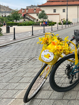 Krakow, Poland, July 26, 2025: A decorated bicycle advertising a shop selling rubber ducks stands on a street in Krakow's Old Town