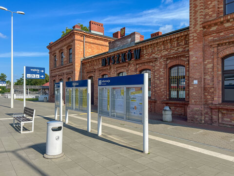 Myszkow, Poland, July 26, 2025: The railway station building in Myszkow, Poland, seen from the platforms. The red brick building is unplastered
