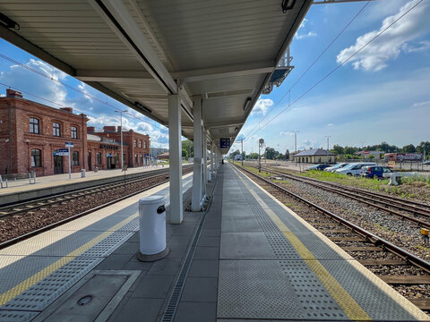 Myszkow, Poland, July 26, 2025: The railway station building in Myszkow, Poland, seen from the platforms. The red brick building is unplastered